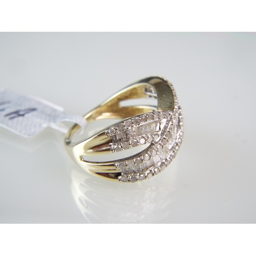 140 - 9ct Gold Multi Diamond set Crossover ring.  3+ carats of Ice Diamonds.   4.4g  Finger size 'O'