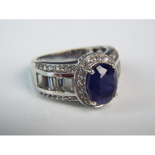 168 - Masoala treated Sapphire Ring surrounded by White topaz on 925 Silver Mount. Finger size 'O'