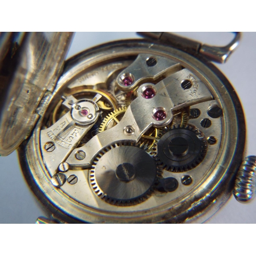 192 - 925 Silver cased imported trench type wristwatch. London hallmark for 1916, Jewelled movement, runs ... 