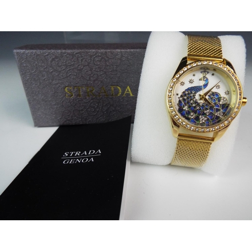 199 - As new and boxed. Strada, Peacock watch. Austrian crystal glass plus bezel studs.