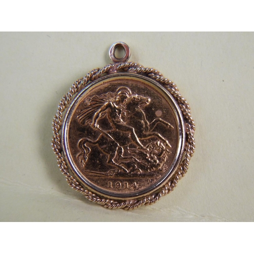 303 - George V Half Sovereign. Date to 1914 in 9ct rope edged pendant mount.