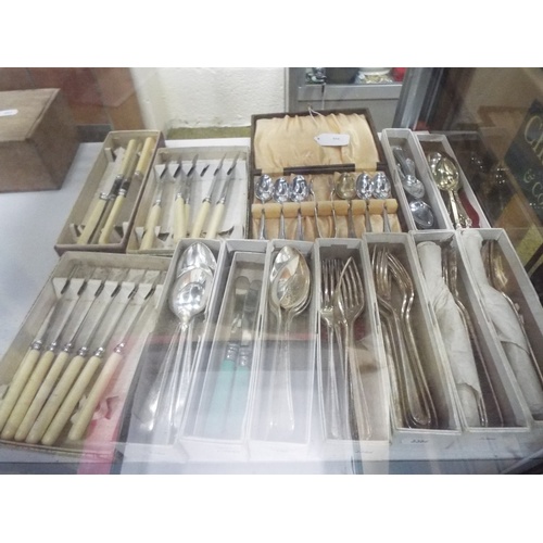 596 - Large selection of boxed cutlery.