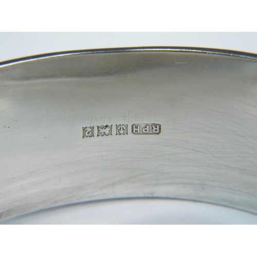 130A - Wide Silver bangle with lovely etched front. Safety chain fitted. Clear hallmarks for Birmingham 196... 