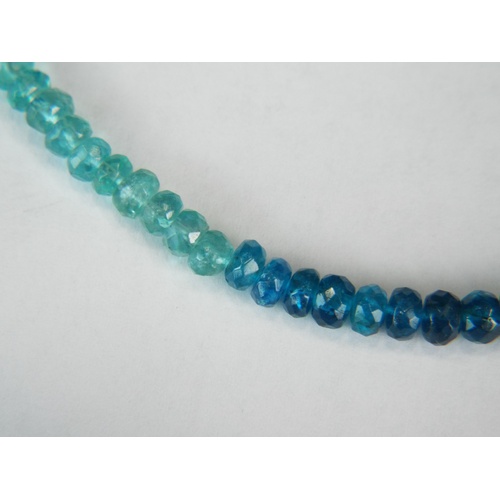 133A - Apetite faceted bead necklace with 9ct gold fastner.
Graduated shades of rare Blue Apetite