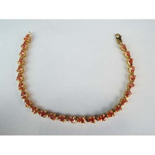 142A - 18ct Yellow gold tennis bracelet set with gorgeous Celon Padparadscha Sapphires.  9.73 cts of Sapphi... 