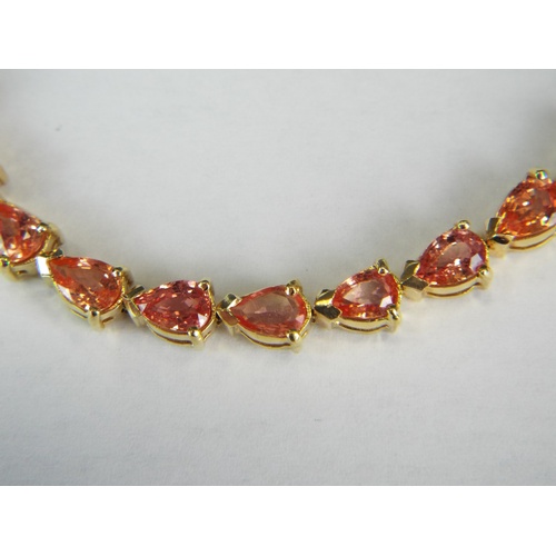 142A - 18ct Yellow gold tennis bracelet set with gorgeous Celon Padparadscha Sapphires.  9.73 cts of Sapphi... 