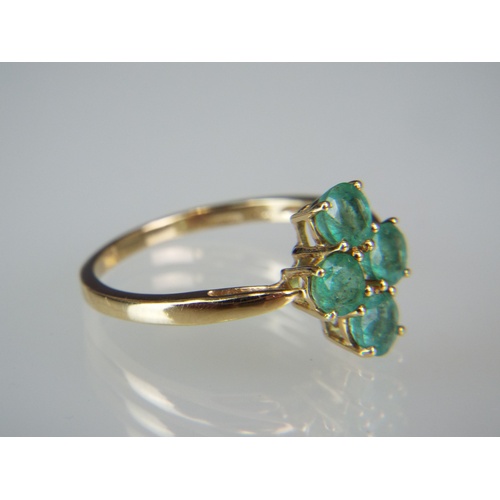 144A - 9ct Yellow Gold ring set with approx 1ct of stunning Zambian Emeralds in a Clover leaf pattern.
Fing... 