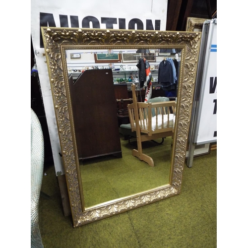 903 - Large ornate gilt framed mirror with bevelled glass.