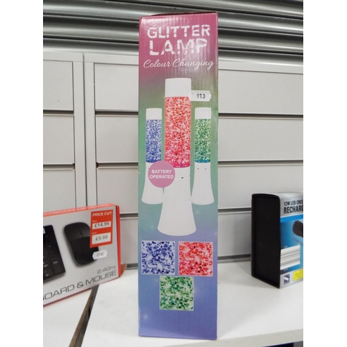 913 - Battery operated colour changing glitter lamp. Boxed and unused.