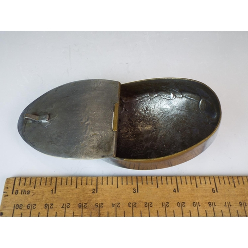 67 - Large pewter snuff box with sheild shaped motif to lid. 4 inches long.