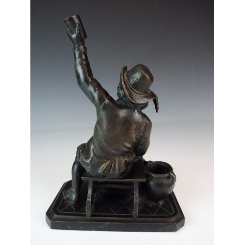 182 - Bronze alloy figure of a celebrating man. 8 inches tall. No signature apparent.