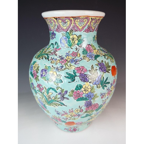 201 - Large Oriental Vase decorated with raised and painted flowers. Base stamp. 10 inches tall.