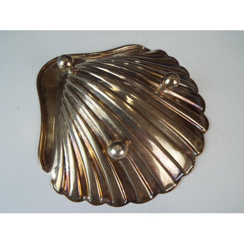 227 - Scallop shell Silver serving dish standing on three bun feet.  5 inches wide. Sheffield 1912   78g  ... 