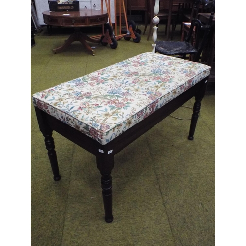 590 - Duet piano stool with hinged top with needlepoint upholstered decoration.   H:21 X W:36 inches.