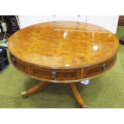 591 - Large drumhead coffee table with eight perimeter drawers.  H:21 x 36 Inch Diameter top. Stands on Ce... 