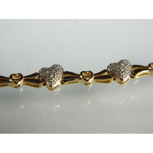 119 - Lovely 9ct Yellow gold 7 inch Bracelet set with twelve Diamond studded hearts. 7.6g