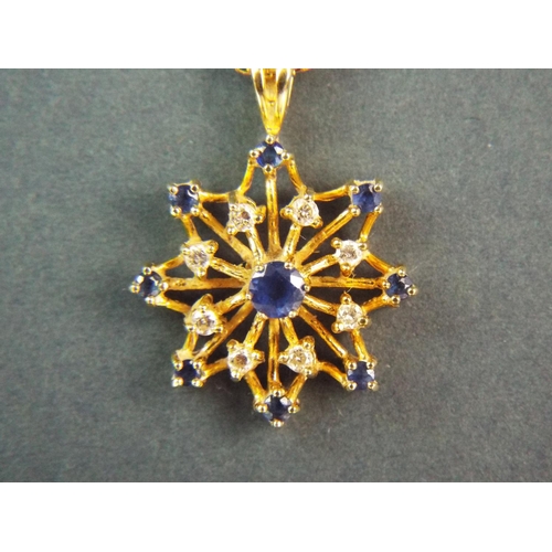 164 - Stunning 18ct Yellow gold pendant set with Diamonds and Sapphires in a star pattern. Set on a 20 inc... 