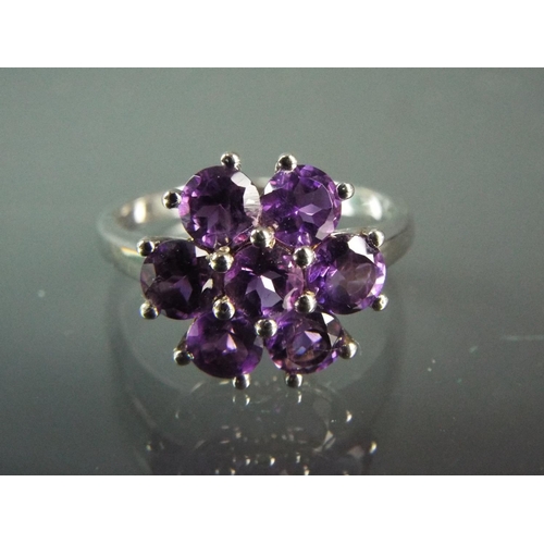 182 - Sterling silver ring set with seven round Zambian Amethysts in a Daisy Cluster design. With COA.  Fi... 