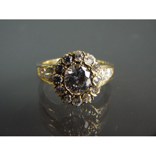 195 - 9ct Yellow gold multi cubic zircona set ring in a flower cluster. Finger size 'N5'   4.2g