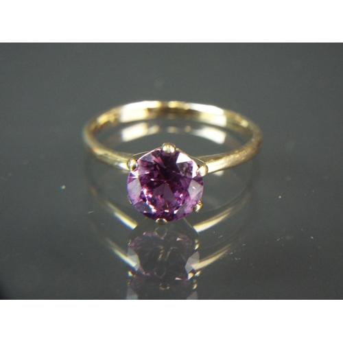 196 - 9ct Yellow gold Solitiare Amethyst set ring.  Finger size 'M5'   1.9g