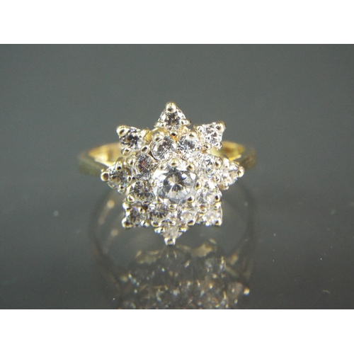 198 - 9ct Yellow Gold Multi Cubic Zircona set ring in a flower cluster. Finger size 'O5'  3.7