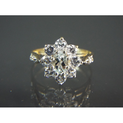 200 - 9ct Yellow Gold Cubic Zircona set ring in a flower cluster.  Finger size 'N'  2.2g