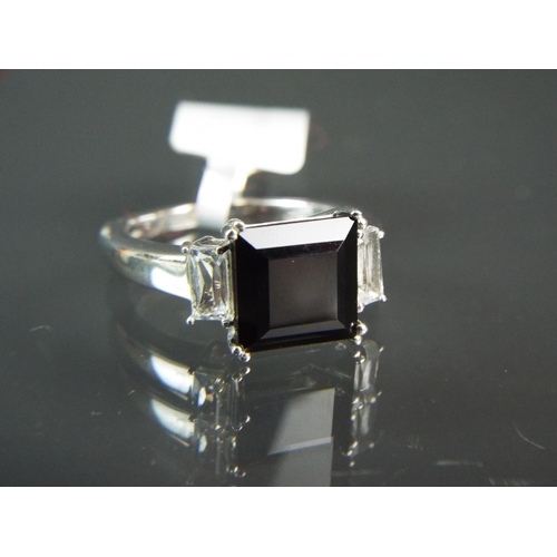 203 - Stylish Sterling silver ring set with a large square Chinese black Spinel. White Topaz to each shoul... 