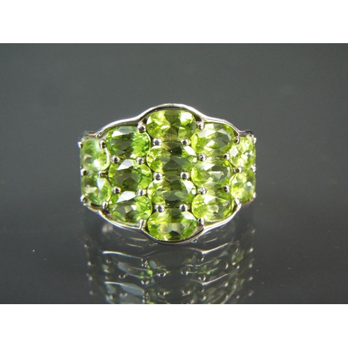 204 - Sterling silver statement ring set with approx 7ct of Chinese Peridot.  With COA.  Finger size 'T'