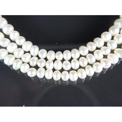 205 - Elegant three strand freshwater pearl necklace with sterling silver clasp and extension loops. With ... 