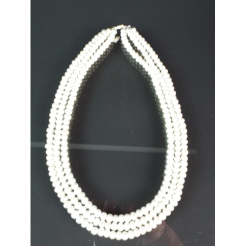 205 - Elegant three strand freshwater pearl necklace with sterling silver clasp and extension loops. With ... 