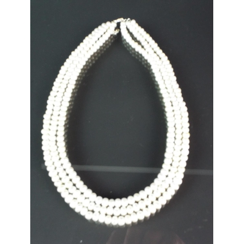 205 - Elegant three strand freshwater pearl necklace with sterling silver clasp and extension loops. With ... 