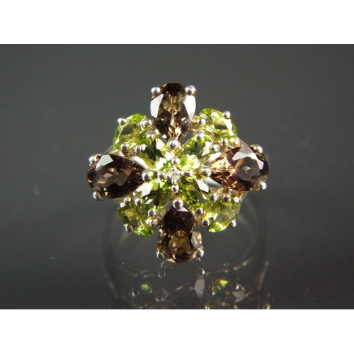 211 - Sterling silver cluster ring set with smokey quartz and Peridot.  Unusual cross inspired design. Fin... 