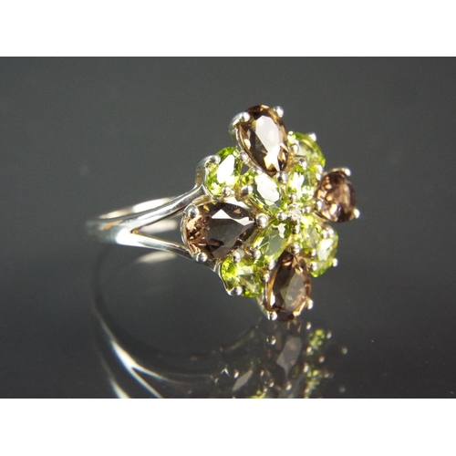 211 - Sterling silver cluster ring set with smokey quartz and Peridot.  Unusual cross inspired design. Fin... 