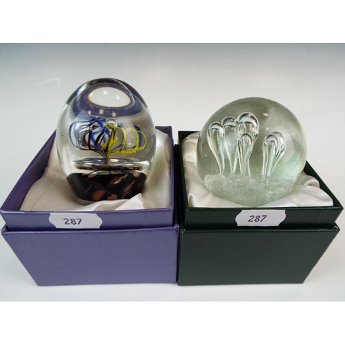 287 - Two boxed blown glass paperweights.