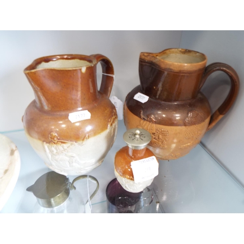 298 - Two Stoneware lambeth style jugs plus matching pepperpot.