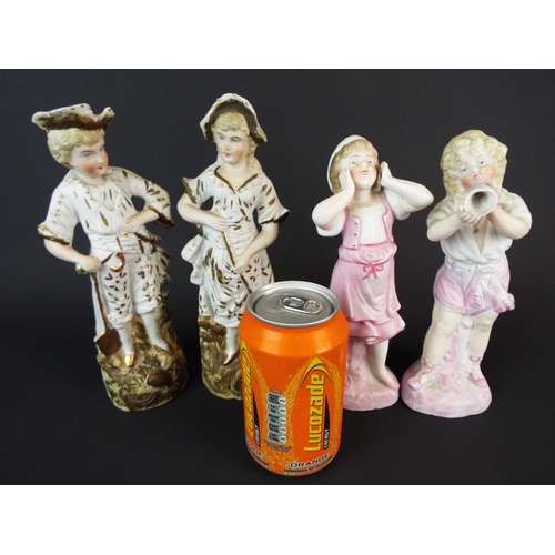 63 - Two matched pairs of Continental bisque porcelaine figurines. Each 7 inches tall.