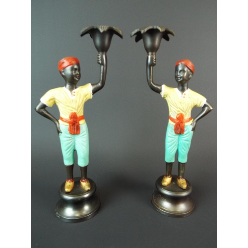 7 - Pair of very heavy cold painted bronze blackamoor candlesticks, each measures 11 inches tall.