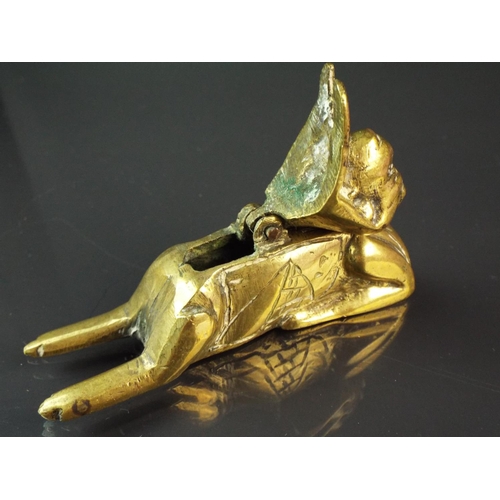 94 - Interesting small brass inwell/pen stand as a sphinx.   4 inches long.