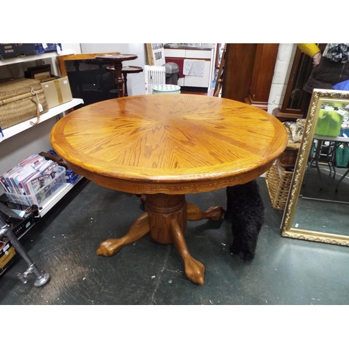 1240 - Large circular table on turned centre column with four legs.