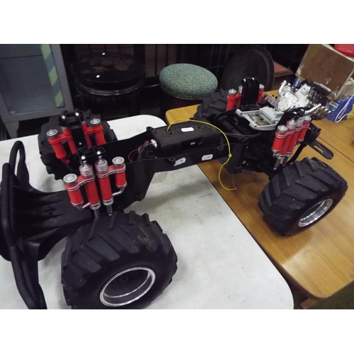 18 - Rolling chassis for battery operated radio controlled model vehicle.  28 inches long