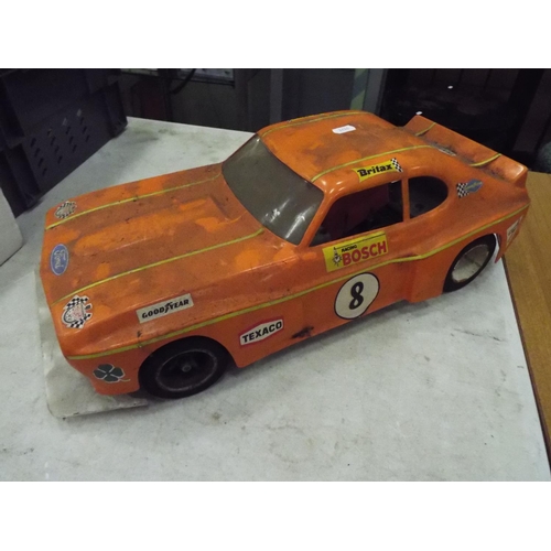 20 - Rolling chassis and plastic bodyshell of a Ford Capri GT car 20 inches long working condition unknow... 