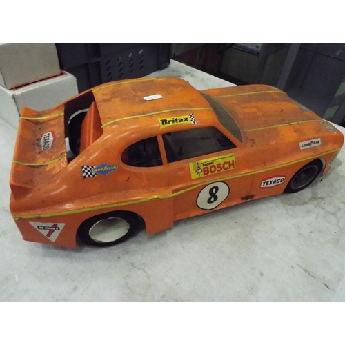 20 - Rolling chassis and plastic bodyshell of a Ford Capri GT car 20 inches long working condition unknow... 