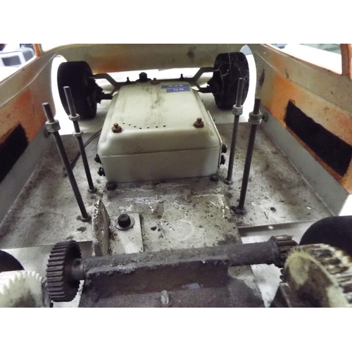 20 - Rolling chassis and plastic bodyshell of a Ford Capri GT car 20 inches long working condition unknow... 