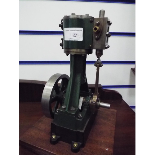 27 - Stuart Number 4 non reversing steam engine on wooden plinth. 11 inches tall standing on wooden plint... 