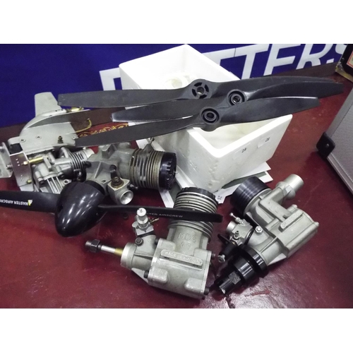 28 - Four model fuel powered aero engines and propellers. Working condition unknown.