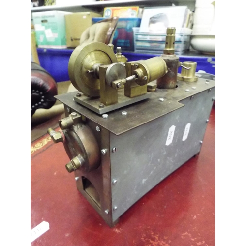 29 - Steam engine in metal cradle. Working condition unknown.