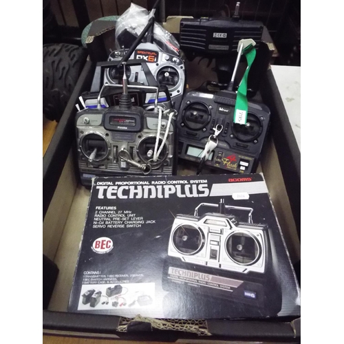 32 - Box of Remote control transmitters. Condition unknown.