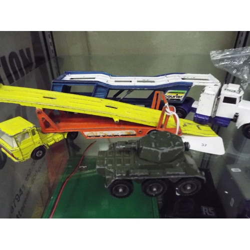 37 - Two playworn matchbox articulated car transporters plus a military vehicle.