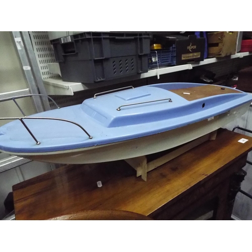 5 - Hull and Superstructure of a powerboat in plastic with electric motor. 32 inches long. Working condi... 