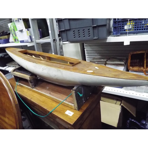 7 - Wooden partly constructed model of a sailboat. 42 inches long with cradle